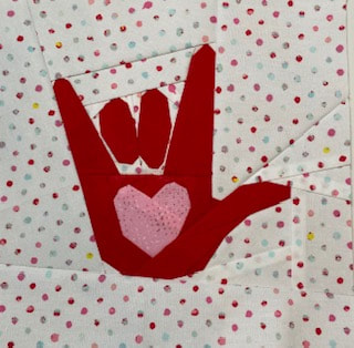 I love you hand sign quilt block pattern, BLM fundraiser pattern, we stand together, quilters against racism